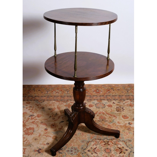 37 - A REGENCY MAHOGANY TWO TIER DUMBWAITER each circular reeded dish raised on brass baluster supports a... 
