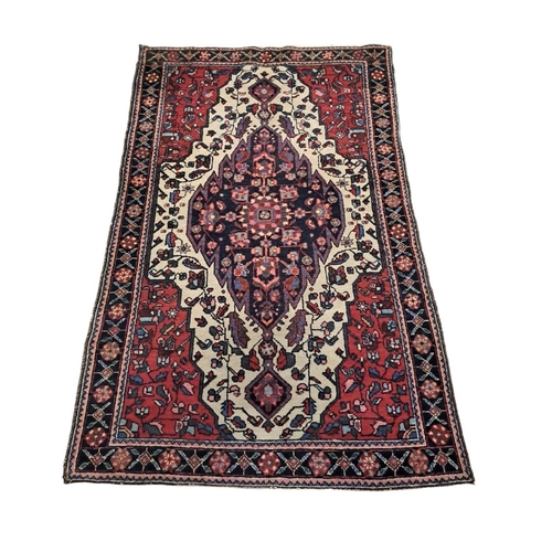 596 - THREE SMALL TRIBAL WOOL RUGS 
Larger 166cm (l) x 108cm (w)
One 155cm (l) x 55cm (w) 
Smaller 83cm (l... 