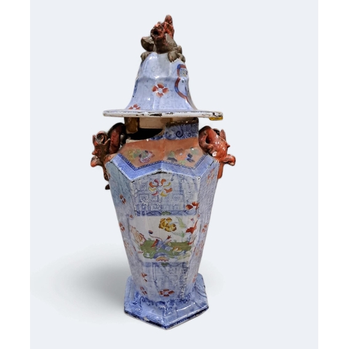 712 - AN ORIENTAL LIDDED JAR of octagonal form the blue ground decorated with flowerheads and foliage surm... 