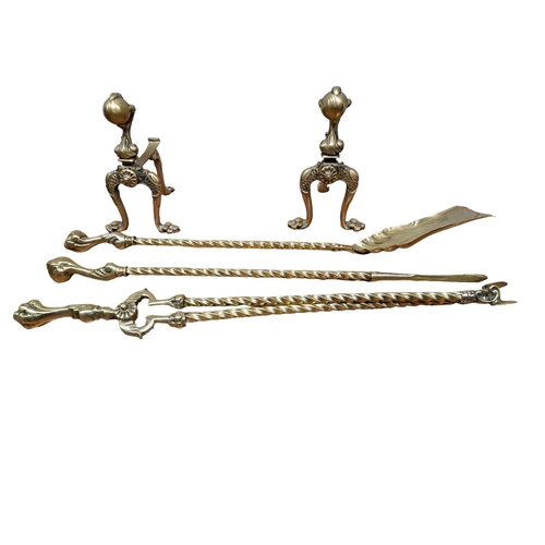 723 - A SET OF THREE BRASS FIRE IRONS with claw and ball handles comprising poker, shovel and tongs togeth... 