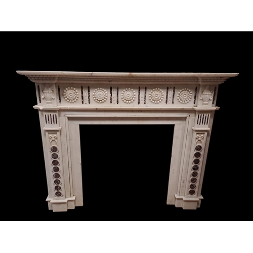 728 - A WHITE MARBLE INLAID CHIMNEY PIECE of inverted breakfront outline the stepped shelf above a paterae... 