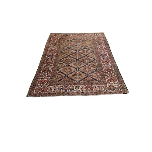 593 - AN ORIENTAL WOOL RUG the beige, light blue and light pink ground with central panel filled with serr... 