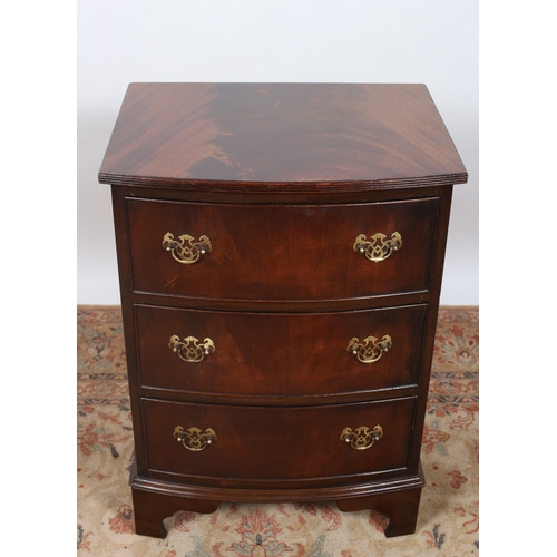 248 - A GEORGIAN STYLE MAHOGANY CHEST of demi lune outline the shaped top above three long drawers with br... 