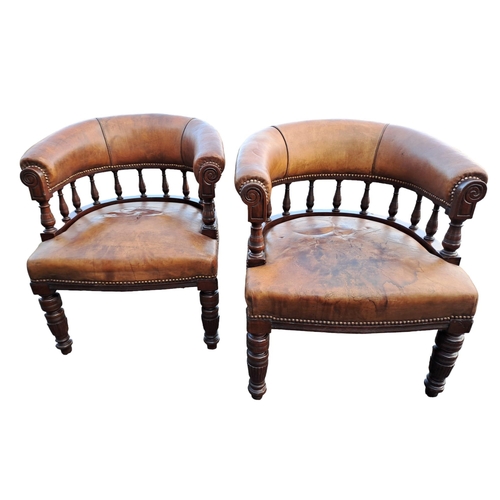 298 - A PAIR OF 19TH CENTURY MAHOGANY AND HIDE UPHOLSTERED LIBRARY TUB CHAIRS by S & H Jewell bears label ... 