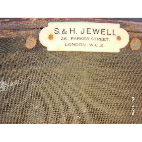 298 - A PAIR OF 19TH CENTURY MAHOGANY AND HIDE UPHOLSTERED LIBRARY TUB CHAIRS by S & H Jewell bears label ... 