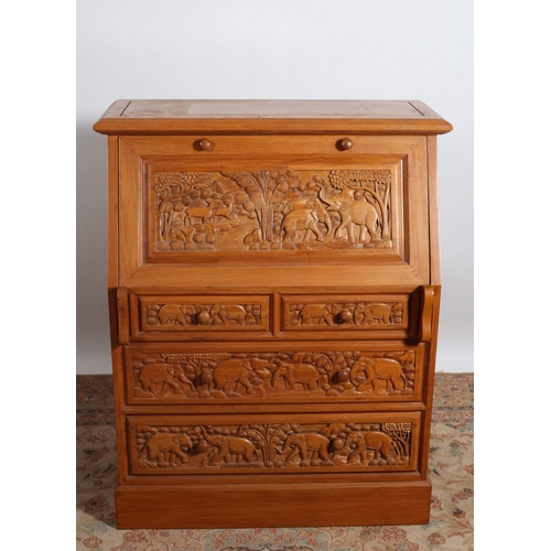 360 - AN ORIENTAL HARDWOOD BUREAU the rectangular top above a carved panel hinged writing slope containing... 