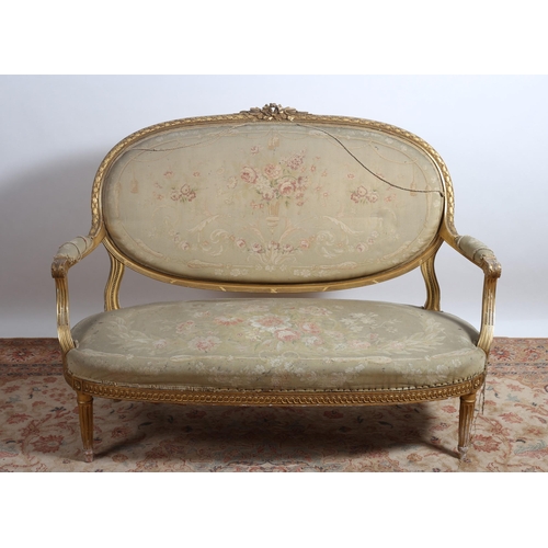 399 - A 19TH CENTURY GILTWOOD AND UPHOLSTERED SETTEE the ribbon tied cresting above an upholstered panel a... 