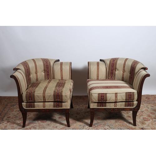 401 - A PAIR OF CONTINENTAL MAHOGANY AND UPHOLSTERED ARMCHAIRS each with a scroll over buttoned upholstere... 