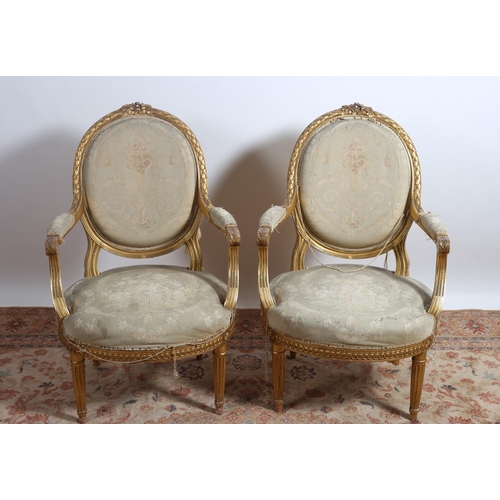 404 - A PAIR OF 19TH CENTURY GILTWOOD AND UPHOLSTERED ELBOW CHAIRS each with a ribbon tied cresting above ... 