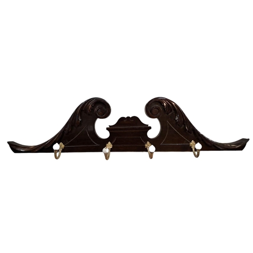 406 - AN EDWARDIAN CARVED MAHOGANY AND GILT BRASS MOUNTED WALL MOUNTED COAT HANGER the swan neck foliate c... 