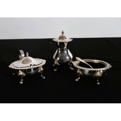 498 - A FIVE PIECE SILVER CONDIMENT SET comprising pepper pot, lidded mustard pot, salt with two silver sa... 