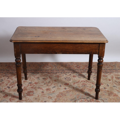 655 - A 19TH CENTURY OAK OCCASIONAL TABLE of rectangular outline with rounded corners on baluster legs 
78... 