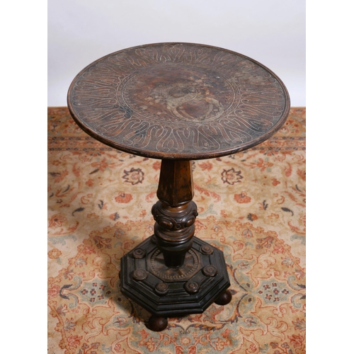 669 - A 19TH CENTURY ASIAN SNAP TOP TABLE the circular engraved top above a faceted and bulbous column on ... 