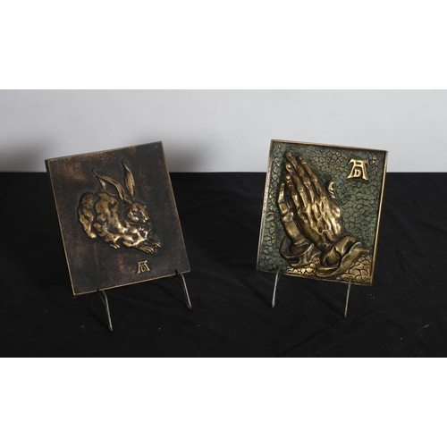 156 - A BRONZE PLAQUE depicting Praying Hands 
16cm (h) x 14cm (w)
A BRONZE PLAQUE depicting A Hare 
17cm ... 