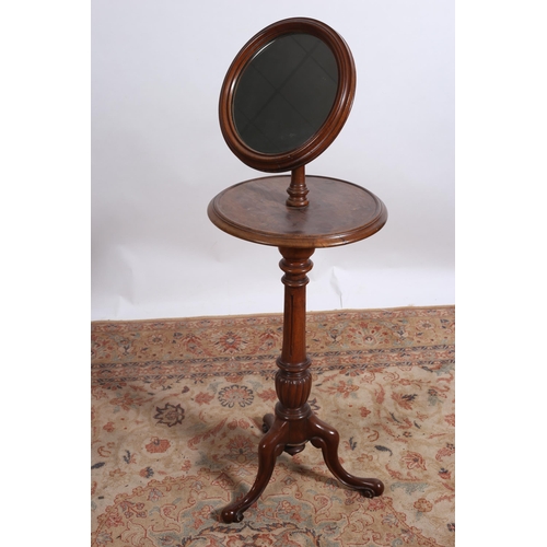 194 - A 19TH CENTURY MAHOGANY SHAVING MIRROR the circular plate within a moulded frame with adjustable arm... 