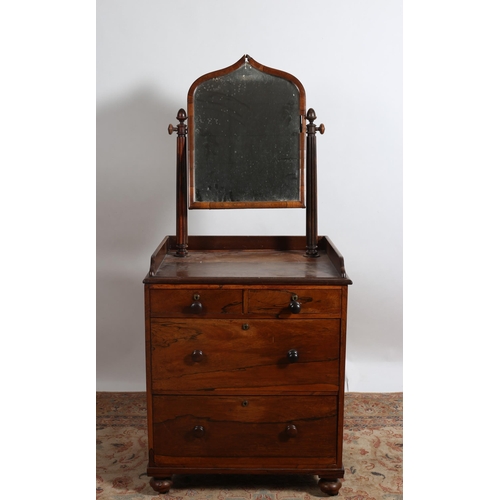 196 - A WILLIAM IV ROSEWOOD DRESSING CHEST the superstructure with swivel mirror raised on fluted supports... 