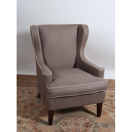 198 - **WITHDRAWN** A VINTAGE MAHOGANY AND UPHOLSTERED WING CHAIR the shaped upholstered back with scroll ... 