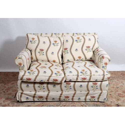 205 - A TWO SEATER SETTEE the rectangular back with scroll over arms and loose cushions with needlework up... 