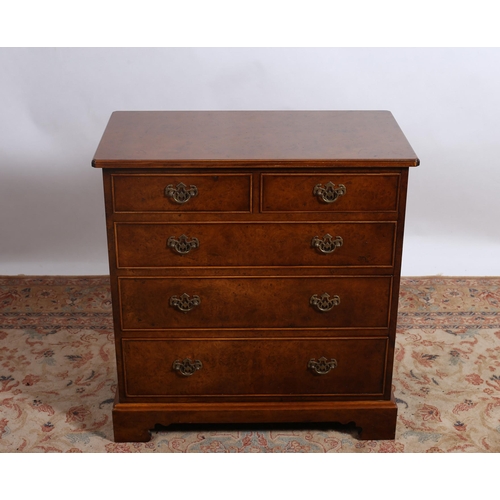 225 - A GEORGIAN DESIGN BURR WALNUT CHEST of rectangular outline the shaped top with satinwood string inla... 