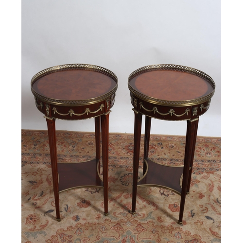 232 - A PAIR OF CONTINENTAL KINGWOOD AND GILT BRASS MOUNTED TABLES each with a circular segmented top with... 