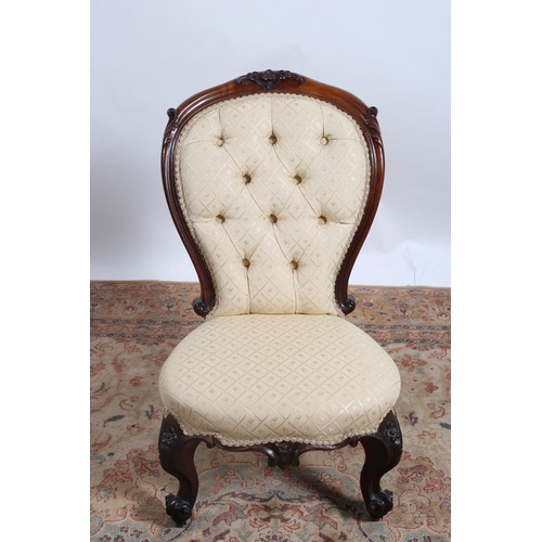 242 - A 19TH CENTURY CARVED MAHOGANY AND UPHOLSTERED NURSING CHAIR the shaped top rail with foliate cresti... 