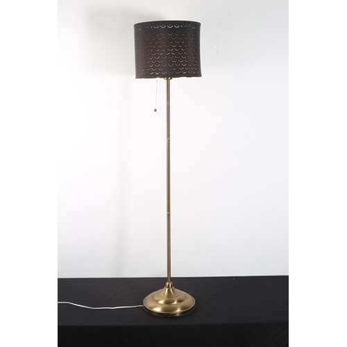 305 - A GILT BRASS FLOOR STANDARD LAMP the cylindrical column above a circular spreading foot with shade 
... 