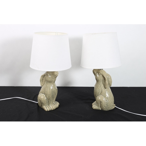 307 - A PAIR OF GLAZED CHINA FIGURAL TABLE LAMPS with shades 
47cm (h)