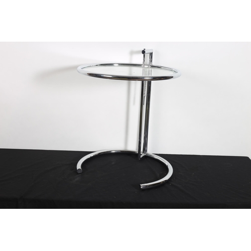 309 - AN EILEEN GREY STYLE CHROME AND GLAZED ADJUSTABLE COFFEE TABLE the circular tubular frame with glaze... 