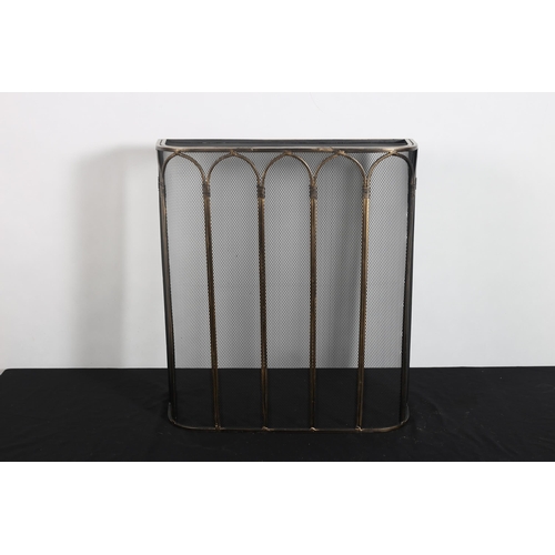 310 - A BRASS AND MESH SPARK GUARD of rectangular bowed outline with arched panels on platform base 
61cm ... 