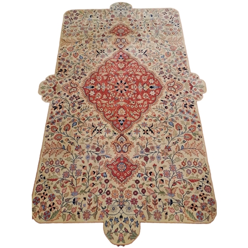 326 - **WITHDRAWN** A WOOL RUG the indigo, coffee and light red ground with central panel filled with styl... 