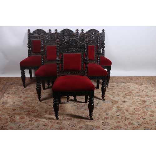 338 - A SET OF SIX 19TH CENTURY CARVED OAK DINING CHAIRS each with a shaped back with upholstered panels a... 