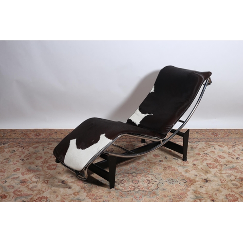 349 - A LE CORBUSIER STYLE CHAISE LONGUE the chrome tubular frame with cowhide loose cushion raised on a b... 