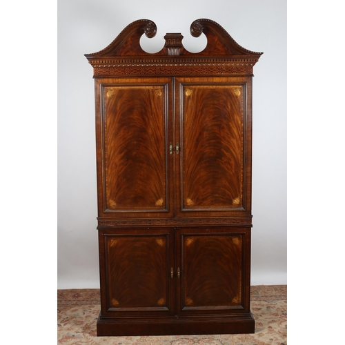 353 - A CHIPPENDALE DESIGN MAHOGANY CABINET the swan neck pediment above a dentil moulded and blind fret f... 