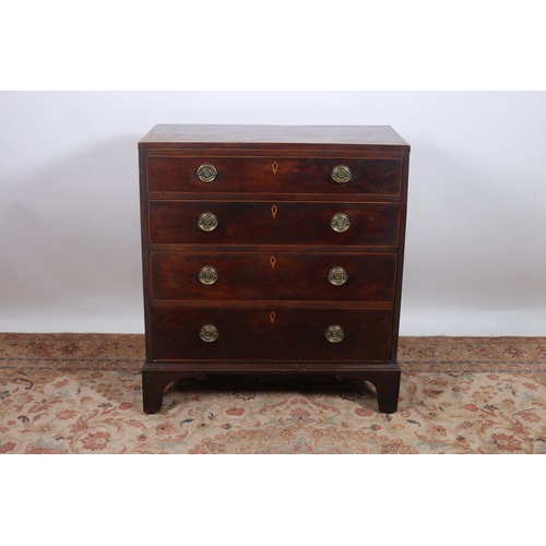 355 - A GEORGIAN MAHOGANY CHEST of rectangular outline the shaped top above four long graduated drawers wi... 