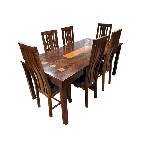 371 - A HARDWOOD SEVEN PIECE DINING ROOM SUITE comprising six dining chairs with vertical splats and coppe... 