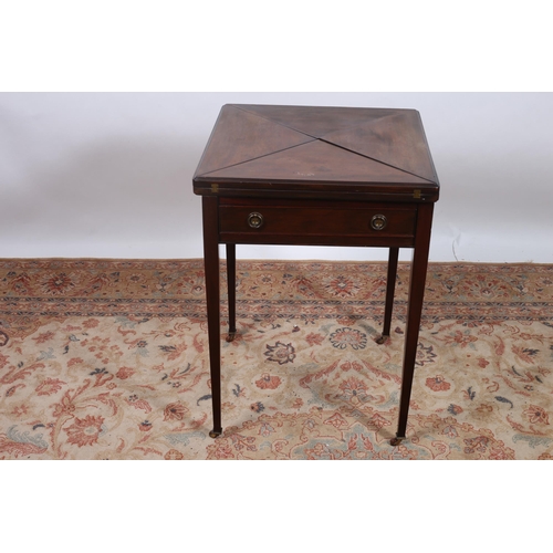 384 - AN EDWARDIAN MAHOGANY ENVELOPE CARD TABLE of square form the shaped top with hinged leaves containin... 