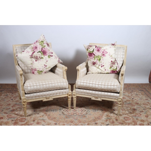 390 - A PAIR OF CONTINENTAL CREAM PAINTED AND UPHOLSTERED ARMCHAIRS each with a rectangular upholstered ba... 