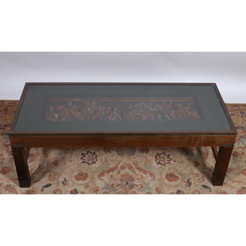 391 - A MAHOGANY AND BRASS BOUND COFFEE TABLE of rectangular outline the shaped top with glazed panel depi... 