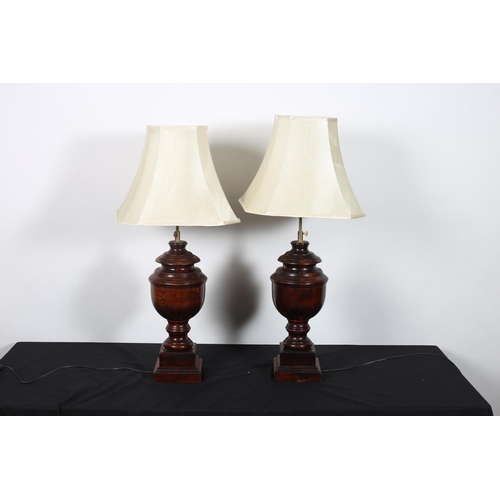 408 - A PAIR OF STAINED WOOD AND BRASS TELESCOPIC TABLE LAMPS each of urn form raised on a square stepped ... 