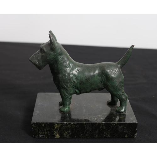 477 - A BRONZE FIGURE modelled as a terrier shown standing on a black veined marble base 
10cm (h) x 12cm ... 