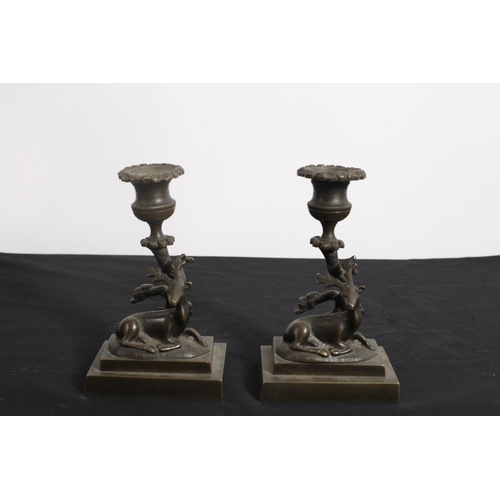 479 - A PAIR OF 19TH CENTURY CAST BRONZE CANDLESTICKS each with a rustic column on a stepped platform base... 