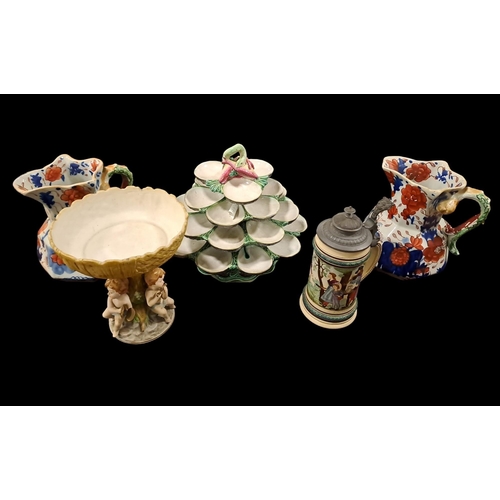 484 - A COLLECTION OF CHINA to include a Majolica eggery, a pair of mason style jugs, an Oriental blue and... 