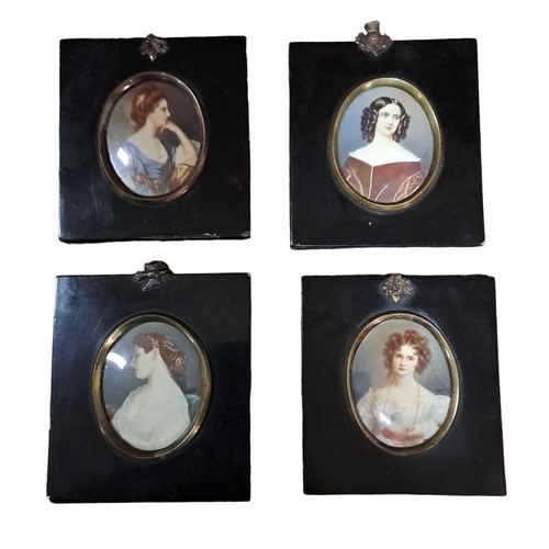 486 - A SET OF FOUR HALF LENGTH MINIATURE PORTRAITS OF FEMALES in ebonised and gilt brass frames 
Each 8cm... 