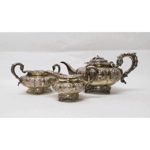 515 - A GEORGIAN IRISH SILVER EMBOSSED THREE PIECE TEA SET for J. Mahony Dublin 1834
60 troy ounces