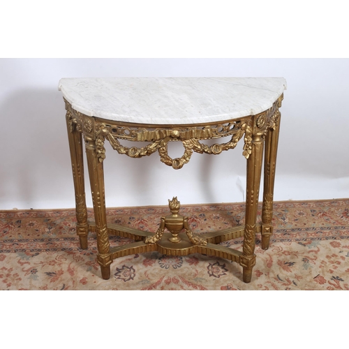 55 - **WITHDRAWN** A 19TH CENTURY CONTINENTAL GILTWOOD AND GESSO CONSOLE TABLE of demi lune outline surmo... 