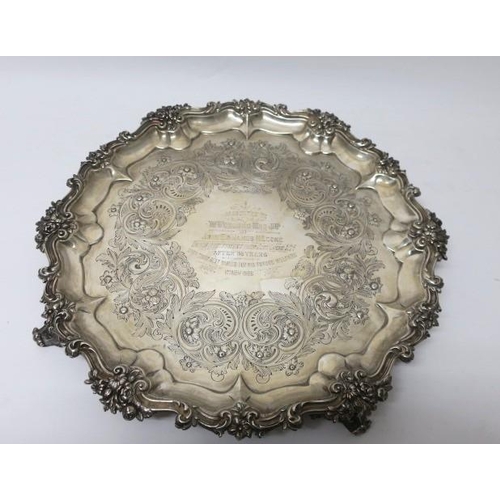 558 - A VICTORIAN SILVER ENGRAVED TRAY with flowerhead and foliage scroll border on scroll legs inscribed ... 