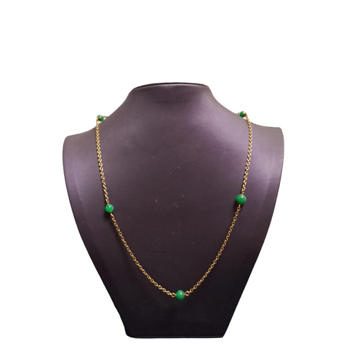 638 - A GOLD AND JADE NECKLACE