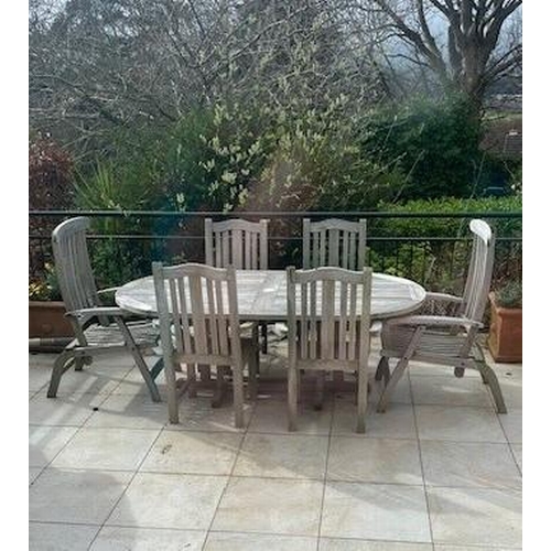 646 - AN EIGHT PIECE HARDWOOD PATIO SUITE comprising four elbow chairs, a pair of reclining chairs, sun lo... 