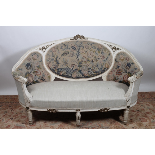 647 - A CONTINENTAL GREY PAINTED PARCEL GILT AND NEEDLEWORK UPHOLSTERED SETTEE the moulded frame with ribb... 