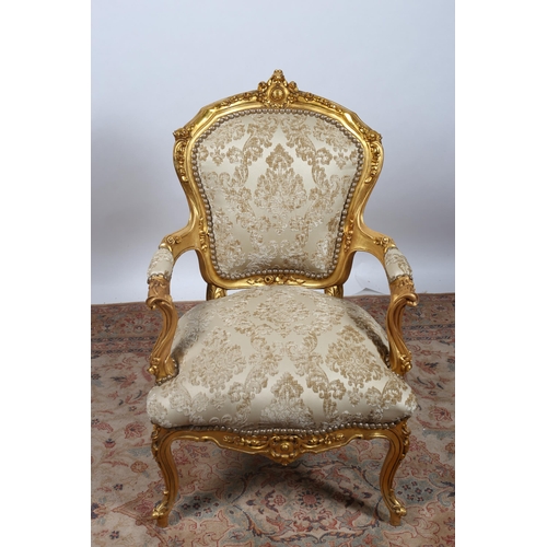 652 - A CONTINENTAL GILTWOOD AND UPHOLSTERED ARMCHAIR the flowerhead and foliate carved frame with upholst... 